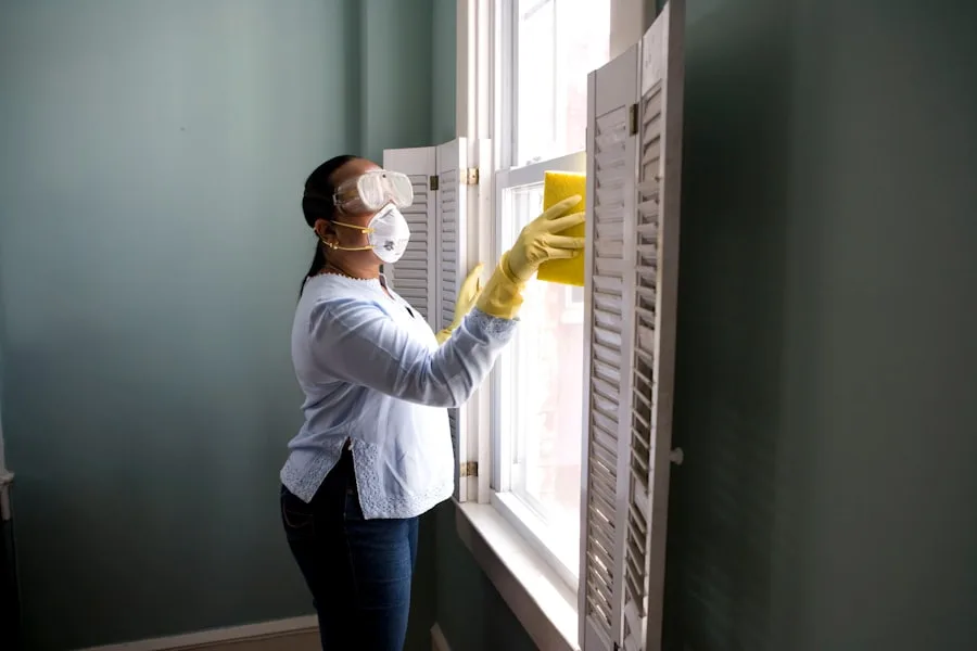 Cleaner wiping the inside of a window frame