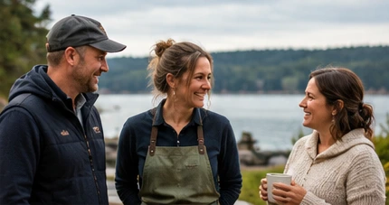 Three people talking and laughing by the water