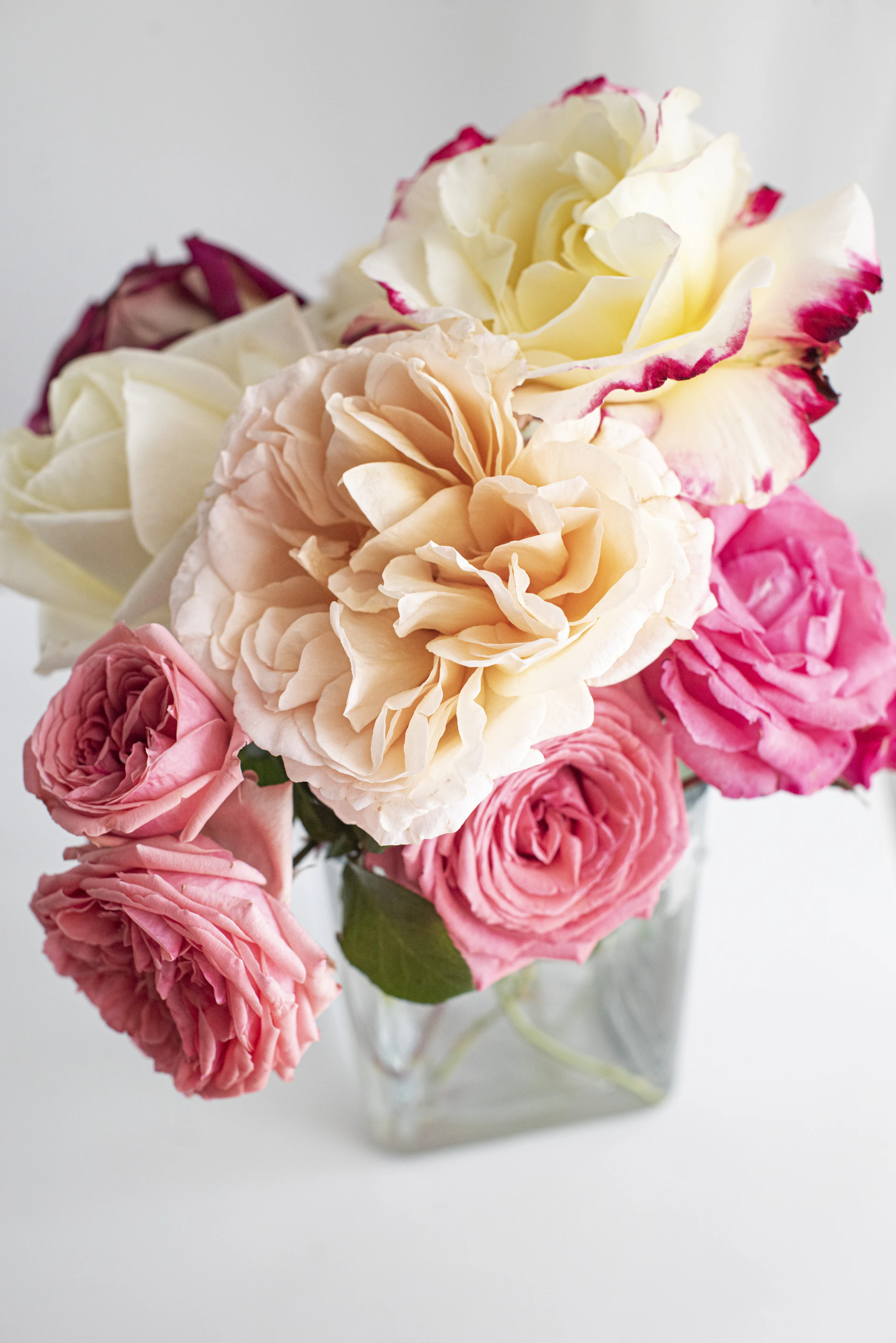 The Orchard Walk bouquet — peach and cream roses in soft light