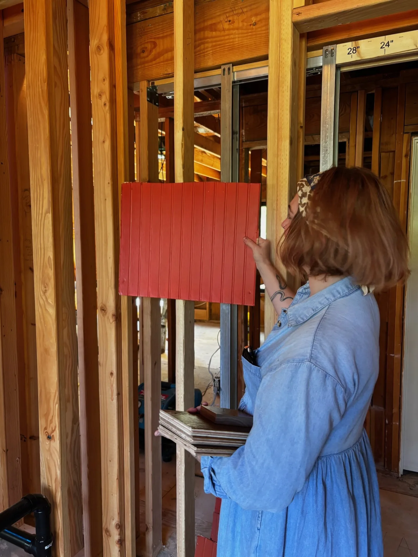 Whitney Page with material samples and consulting materials