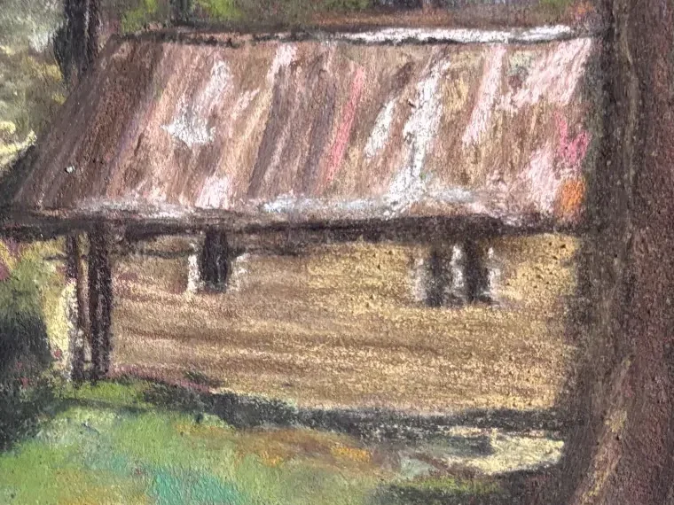 Close-up of the cabin: the tin roof in pinks and rust over an ochre wall