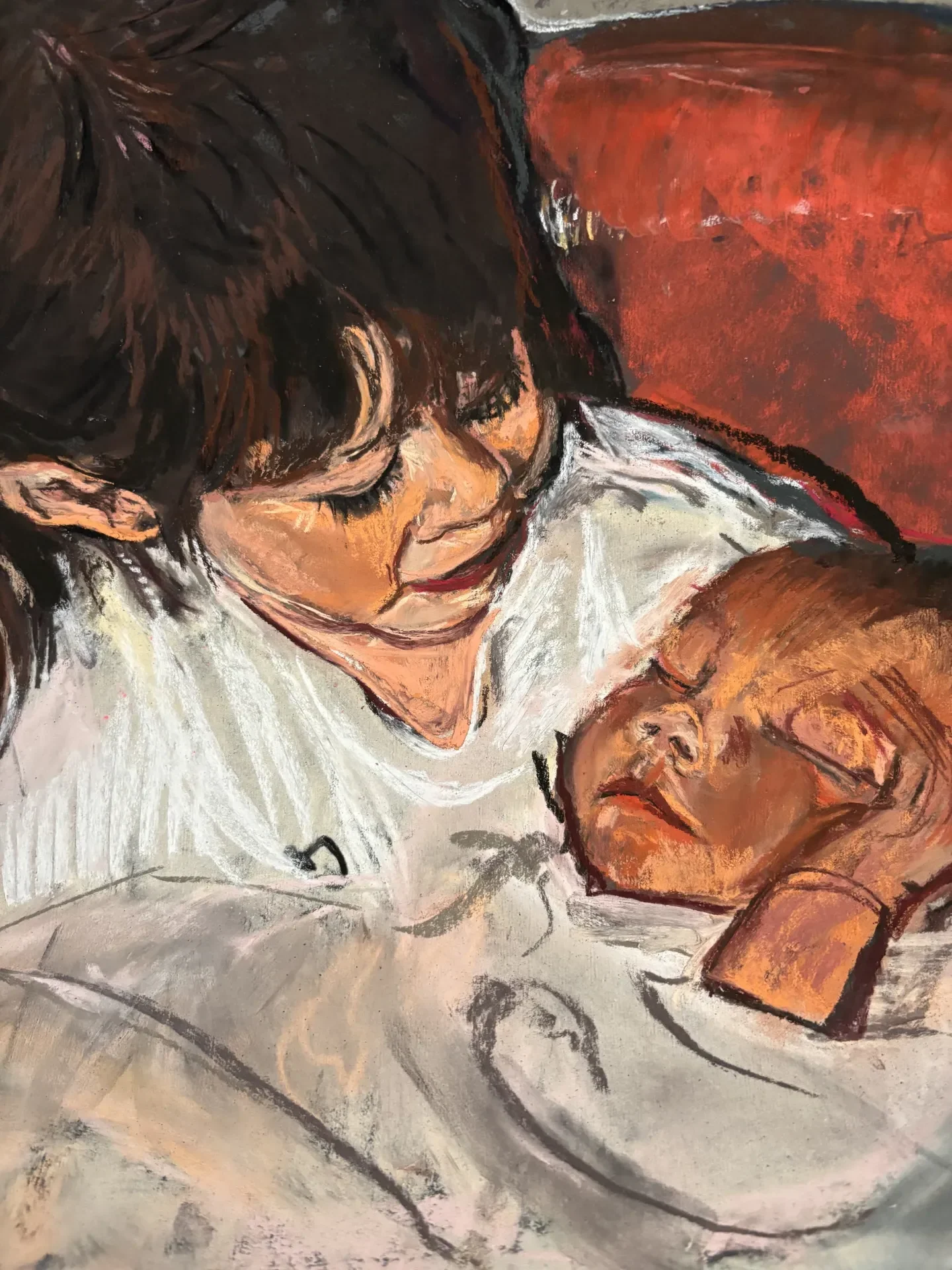 Pastel of a dark-haired woman asleep with a baby in her arms against a red cushion