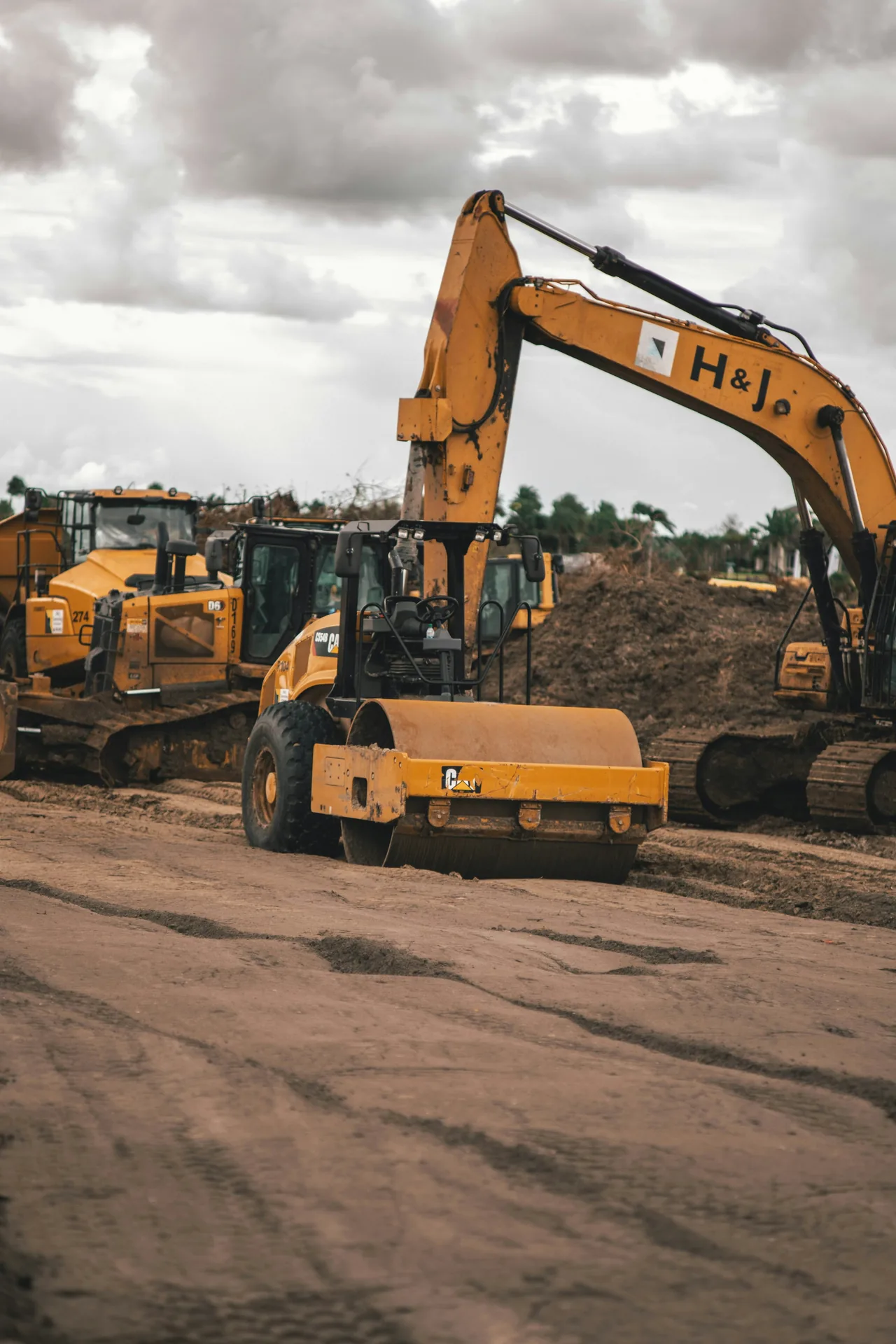 Owned heavy equipment on a graded site