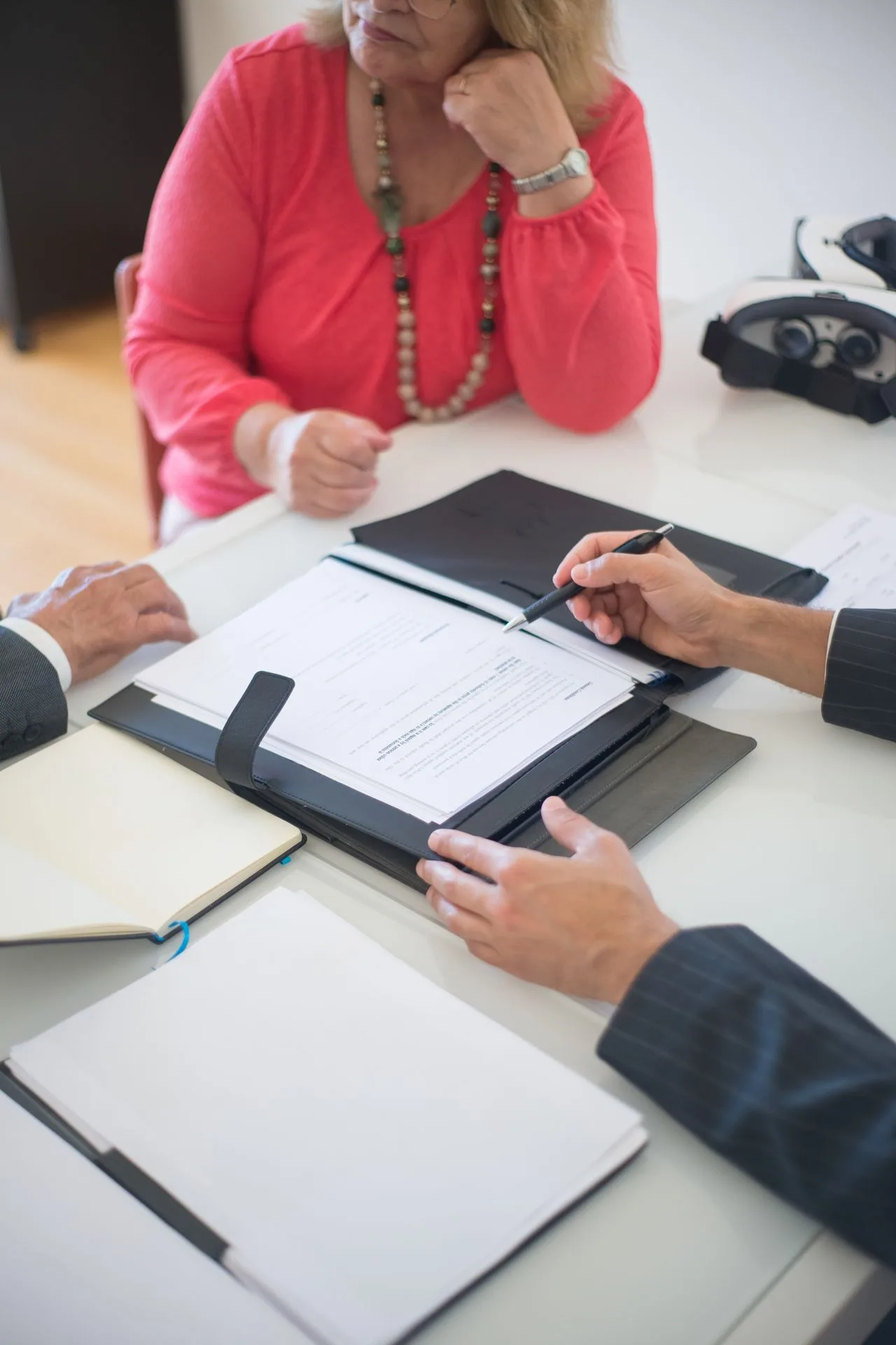 Clients reviewing a real-estate contract with their advisor