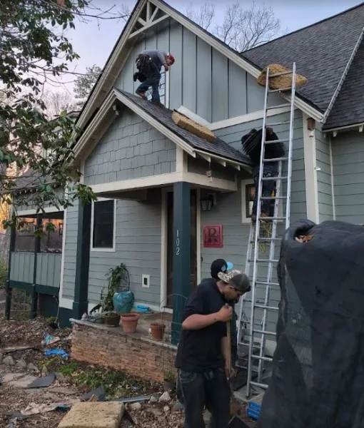 Top Notch Roofing crew re-roofing a craftsman-style home
