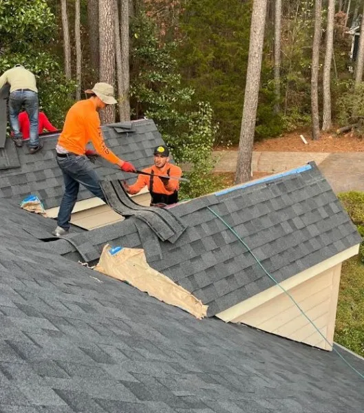 Top Notch Roofing crew installing new shingles on a home