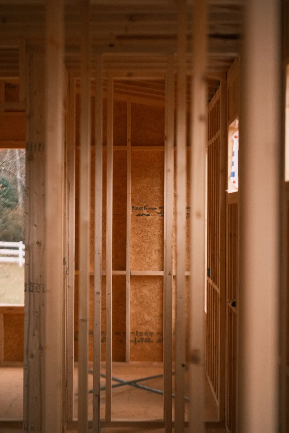 Interior stud framing and a new door opening in a room under construction