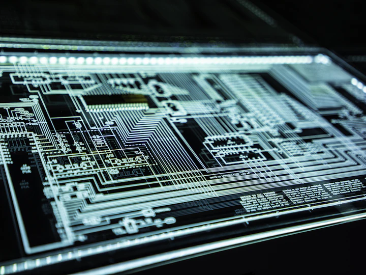A glowing circuit board photographed close up