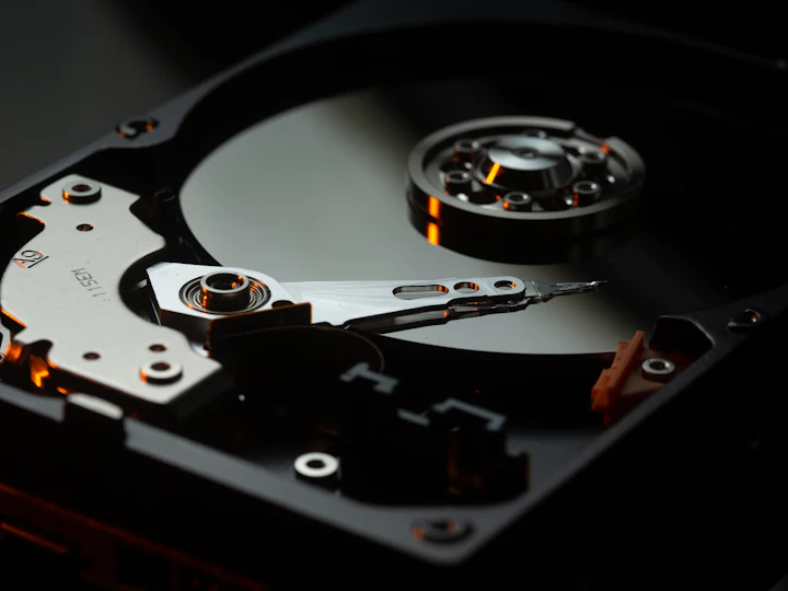 Close-up of the read head and platter inside an open hard drive