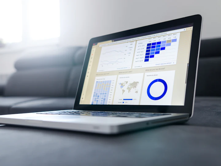 A laptop showing a business intelligence dashboard