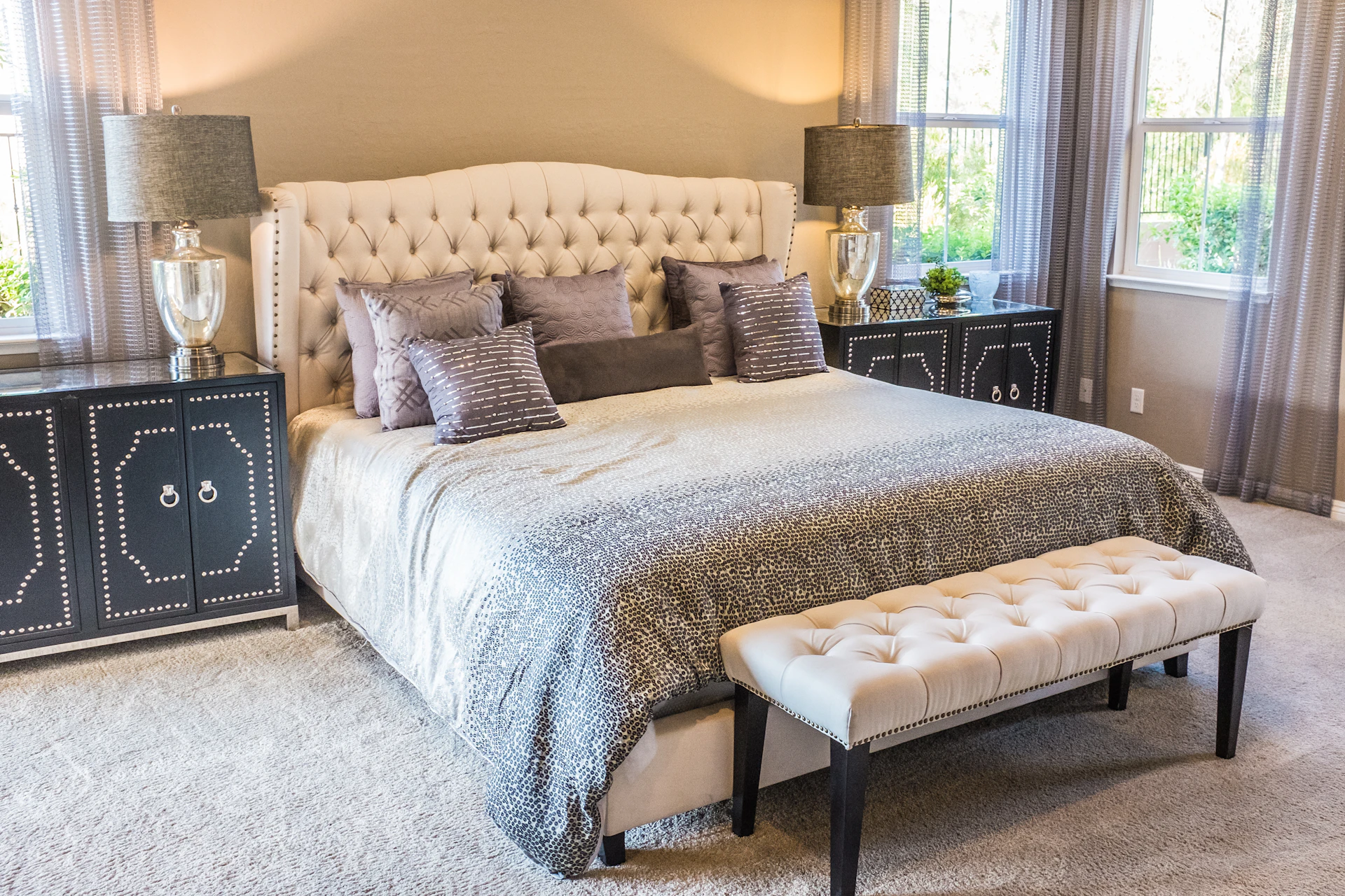 A cozy cottage bedroom with white linens and morning light.