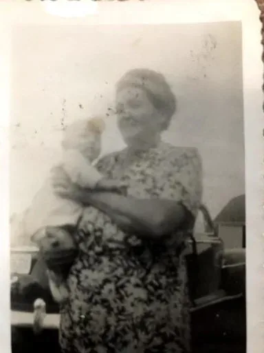 A black and white photograph of Tekla Sophia, Brian&rsquo;s grandmother, holding a child on the Minnesota homestead