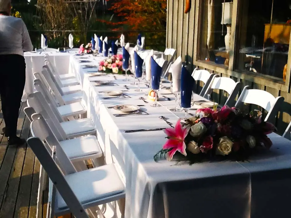 Long table set for a celebration on the deck