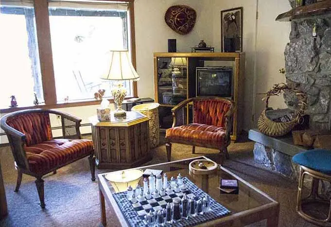 Pond Suite sitting room beside the stone fireplace