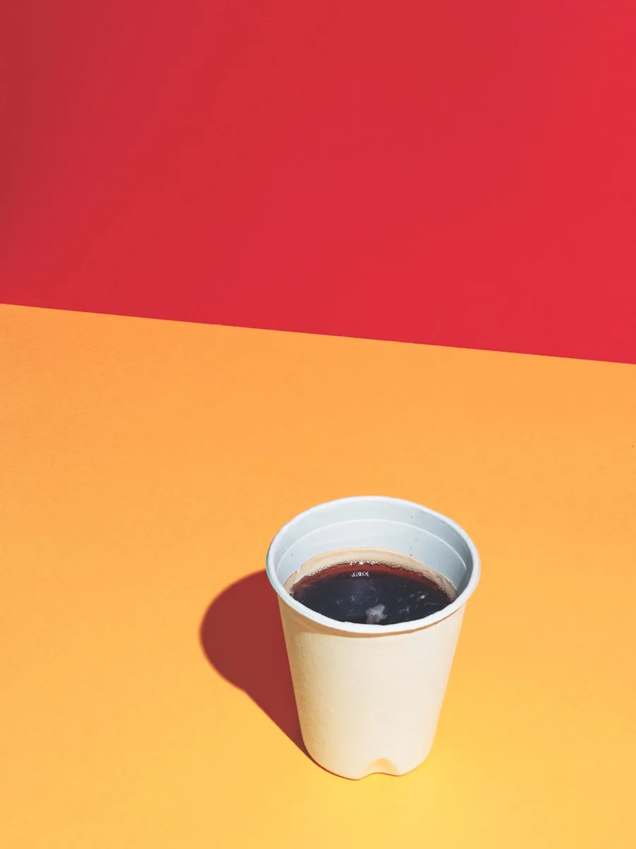 Top-down view of coffee in a paper to-go cup