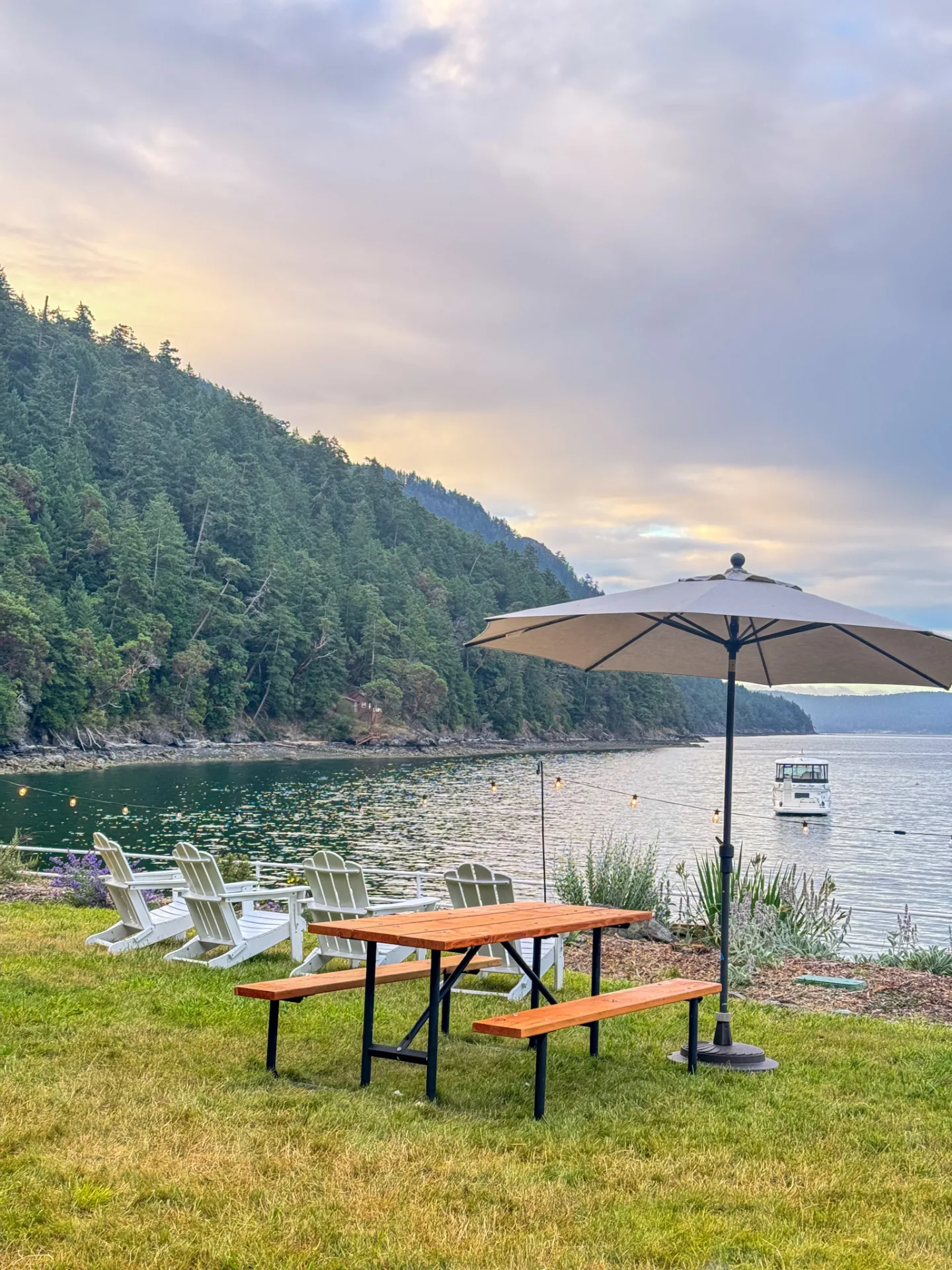 Adirondack chairs on the lawn overlooking Cascade Bay and the harbor